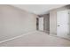 An airy bedroom with a standard door and entrance to another room at 61 Okeechobee Way, Braselton, GA 30548