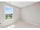 Comfortable bedroom with bright window providing abundant natural light at 61 Okeechobee Way, Braselton, GA 30548