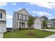 Beautiful home with a well-maintained lawn, two-car garage and craftsman details at 61 Okeechobee Way, Braselton, GA 30548