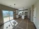 Open-concept kitchen with white cabinets, stainless steel appliances, and a breakfast bar island at 61 Okeechobee Way, Braselton, GA 30548
