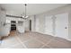 Kitchen with stainless steel appliances, a kitchen island, and modern white cabinetry at 61 Okeechobee Way, Braselton, GA 30548