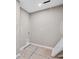 A gray-painted laundry room with laundry connections and white door at 61 Okeechobee Way, Braselton, GA 30548