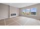 Spacious living room featuring modern fireplace, recessed lighting, and large windows with a view at 61 Okeechobee Way, Braselton, GA 30548