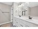Bright main bathroom with double sink vanity and black hardware at 61 Okeechobee Way, Braselton, GA 30548