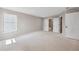 Spacious main bedroom with bright windows and access to bathroom and closet at 61 Okeechobee Way, Braselton, GA 30548