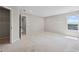 Bright main bedroom with ample closet space and neighborhood views at 61 Okeechobee Way, Braselton, GA 30548
