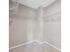 A corner walk-in closet with white wire shelving for storage and organization at 61 Okeechobee Way, Braselton, GA 30548