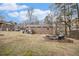 Spacious backyard has a fire pit and a deck at 6355 Queens Rd, Douglasville, GA 30135
