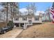 Home featuring a two-car garage and a welcoming front porch at 6355 Queens Rd, Douglasville, GA 30135