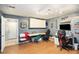 This game room is decorated with car signs and has dual gaming chairs at 6355 Queens Rd, Douglasville, GA 30135