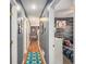 Hallway with wood floors and doors leading to rooms, including a bedroom at 6355 Queens Rd, Douglasville, GA 30135