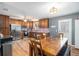 Well-appointed kitchen featuring ample cabinetry, stainless steel appliances, and a dining area at 6355 Queens Rd, Douglasville, GA 30135