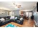 Open living room with a fireplace, adjacent dining area, and modern decor at 6355 Queens Rd, Douglasville, GA 30135