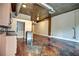 Modern kitchen area with stainless steel appliances, granite counters and backsplash with exposed utilities at 123 Luckie Nw St # 2510, Atlanta, GA 30303