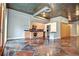 Spacious living room featuring a modern kitchen, stained concrete floors and exposed utilities at 123 Luckie Nw St # 2510, Atlanta, GA 30303