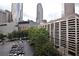 Exterior view of the parking decks with a view of the city skyline and lush green trees at 123 Luckie Nw St # 2510, Atlanta, GA 30303