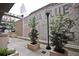 A charming courtyard-style patio features stylish trees, planters, and a vintage Georgia Blue sign at 123 Luckie Nw St # 2510, Atlanta, GA 30303