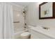 Bright bathroom featuring a shower over tub with white tile surround, vanity, and toilet at 4575 Jamerson Forest Pkwy, Marietta, GA 30066