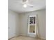 Carpeted bedroom featuring a window with curtains and a ceiling fan above at 4575 Jamerson Forest Pkwy, Marietta, GA 30066