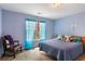 Inviting bedroom with a comfortable bed, soft lighting, and a serene ambiance for restful nights at 755 Creek Wind Ct, Johns Creek, GA 30097