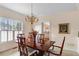 Dining room with a polished table and chandelier at 755 Creek Wind Ct, Johns Creek, GA 30097