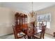 Dining room with a chandelier and hutch at 755 Creek Wind Ct, Johns Creek, GA 30097