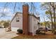 Rear exterior view showing siding, brick foundation, and deck at 755 Creek Wind Ct, Johns Creek, GA 30097