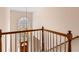 Grand foyer showcasing a staircase, large window, and chandelier, offering a bright and welcoming entrance at 755 Creek Wind Ct, Johns Creek, GA 30097