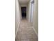 Neutral hallway with tile flooring at 755 Creek Wind Ct, Johns Creek, GA 30097