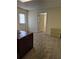 A comfortable office space with an open doorway and neutral carpet at 755 Creek Wind Ct, Johns Creek, GA 30097