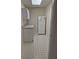 Compact pantry with cabinets, counter space, and a full-size refrigerator at 755 Creek Wind Ct, Johns Creek, GA 30097