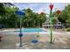 Sparkling community pool area with lounge chairs and splash pad features at 755 Creek Wind Ct, Johns Creek, GA 30097