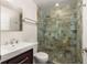 Modern bathroom featuring a mosaic tile shower, floating vanity, and updated fixtures at 1526 Stone Gate Se Ln, Atlanta, GA 30317