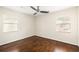 Bright bedroom featuring hardwood floors, neutral walls, and a modern ceiling fan at 1526 Stone Gate Se Ln, Atlanta, GA 30317