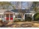 Charming single-story home with a well-maintained front yard and inviting red front doors at 1526 Stone Gate Se Ln, Atlanta, GA 30317