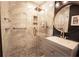 Modern bathroom with walk-in shower, marble tile, and sleek fixtures at 1728 Stonecliff Ct, Decatur, GA 30033