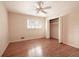 An inviting bedroom features a ceiling fan, closet, neutral walls and hardwood floors at 1728 Stonecliff Ct, Decatur, GA 30033