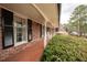 A welcoming covered front porch with brick flooring at 1728 Stonecliff Ct, Decatur, GA 30033