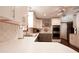 Bright kitchen featuring stainless steel appliances, white cabinetry, and a breakfast bar with quartz countertop at 1728 Stonecliff Ct, Decatur, GA 30033