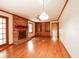 Living room with hardwood floors, brick fireplace, built-in bookcase and large windows at 1728 Stonecliff Ct, Decatur, GA 30033