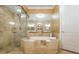 Bathroom featuring walk-in glass shower, soaking tub, and marble tile at 3280 Stillhouse Se Ln # 108, Atlanta, GA 30339