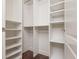 Bright walk-in closet featuring ample shelving and hanging space for clothes and accessories at 3280 Stillhouse Se Ln # 108, Atlanta, GA 30339