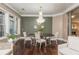 Elegant dining room featuring a modern chandelier and a view into the living room at 3280 Stillhouse Se Ln # 108, Atlanta, GA 30339