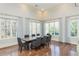 Formal dining room with high ceilings, hardwood floors, large windows, and seating for eight at 3280 Stillhouse Se Ln # 108, Atlanta, GA 30339