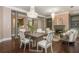 Well-lit living space featuring a dining area, open floor plan, and hardwood floors at 3280 Stillhouse Se Ln # 108, Atlanta, GA 30339