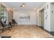 Elegant lobby area with tiled floors, a modern painting, comfortable chairs, and convenient elevator access at 3280 Stillhouse Se Ln # 108, Atlanta, GA 30339