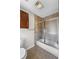 Bathroom featuring a tiled shower, a toilet, and a wood cabinet for storage at 4481 Windsor Oaks Dr, Marietta, GA 30066