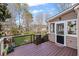 Inviting backyard deck with railing and an entrance to the home makes for easy indoor-outdoor living at 4481 Windsor Oaks Dr, Marietta, GA 30066