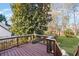 Open-air deck overlooks the manicured lawn, gazebo, and lush landscaping of the private backyard at 4481 Windsor Oaks Dr, Marietta, GA 30066