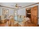 Light-filled dining area with a glass table and stylish wicker chairs adjacent to the kitchen at 4481 Windsor Oaks Dr, Marietta, GA 30066